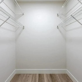 a closet with white walls