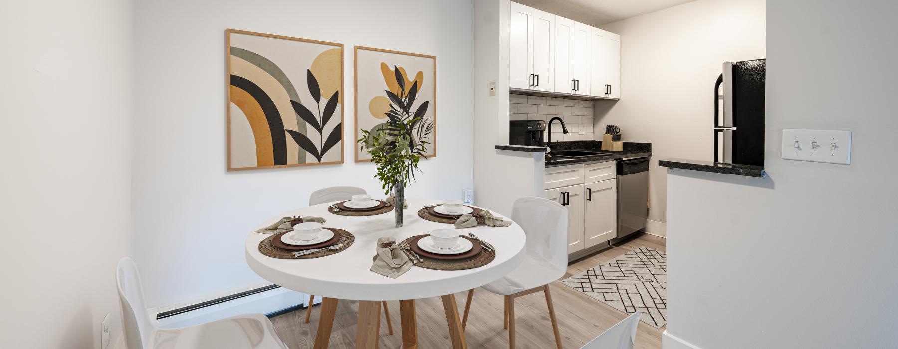 a dining room with a table and chairs