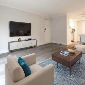 a living room with a tv and couches